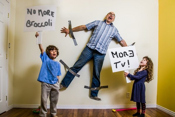 Kids rebellion led to strapping the father on wall