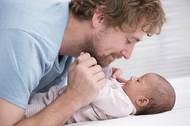 Dad with newborn baby after labour